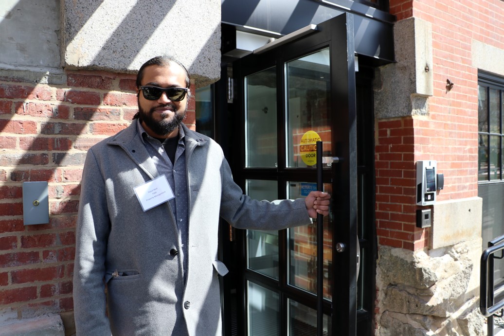 TSNE Director Faisal Abid welcoming visitors to the ribbon cutting ceremony