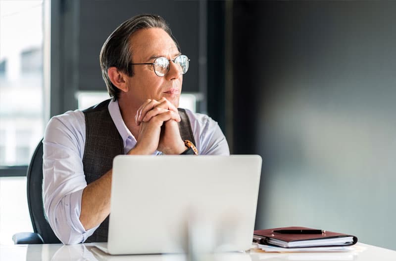 Man at desk thinking